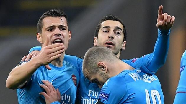 Arsenal FC's Henrikh Mkhitaryan celebrates scoring their first goal against AC Milan in their UEFA Europa League round of 16 first leg match at the San Siro on Thursday. (REUTERS) Arsenal FC's Henrikh Mkhitaryan celebrates scoring their first goal against AC Milan in their UEFA Europa League round of 16 first leg match at the San Siro on Thursday. (REUTERS)