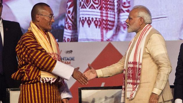 Bhutan's Prime Minister Tshering Tobgay (left) and Prime Minister Narendra Modi greet each other at the inaugural function of Advantage Assam Global Investor's Summit 2018 in Guwahati.(AP File Photo)
