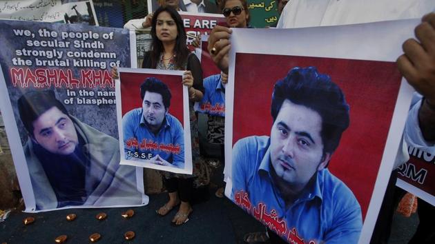 Members of a Pakistani civil society group hold posters showing university student Mohammad Mashal Khan during a demonstration against his killing, in Karachi, Pakistan.(AP File Photo)