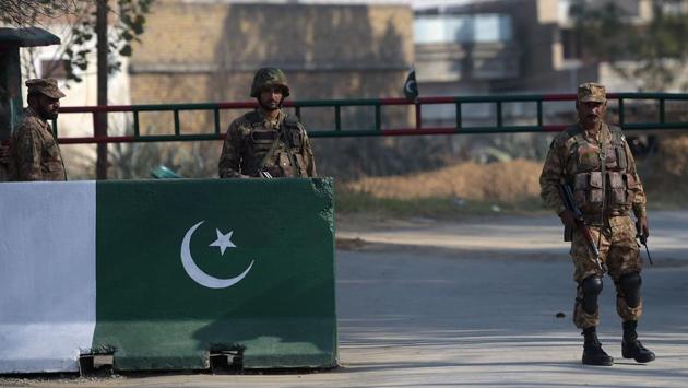 Pakistani soldiers stand guard in Haripur district. The verdict is major victory of hardliners who were pressing that Ahmadiyyas working in government offices should be identified. (AFP Photo) Pakistani soldiers stand guard in Haripur district. The verdict is major victory of hardliners who were pressing that Ahmadiyyas working in government offices should be identified. (AFP Photo)