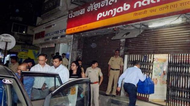 Enforcement Directorate officials outside PNB branch in Thane after they seized cash, jewellery and bonds worth several crores during a raid in relation to Nirav Modi-PNB scam in Thane on February 20, 2018. (PTI File Photo) Enforcement Directorate officials outside PNB branch in Thane after they seized cash, jewellery and bonds worth several crores during a raid in relation to Nirav Modi-PNB scam in Thane on February 20, 2018. (PTI File Photo)