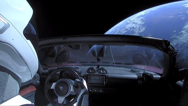 Among the legions of fans of The Hitchhikers Guide to the Galaxy, is Elon Musk, who recently sent a Tesla Roadster into space, driven by a mannequin in a SpaceX spacesuit, with a copy of the book in the glove compartment and the words “Don’t Panic” (in large, friendly letters) on the dashboard (REUTERS) Among the legions of fans of The Hitchhikers Guide to the Galaxy, is Elon Musk, who recently sent a Tesla Roadster into space, driven by a mannequin in a SpaceX spacesuit, with a copy of the book in the glove compartment and the words “Don’t Panic” (in large, friendly letters) on the dashboard (REUTERS)