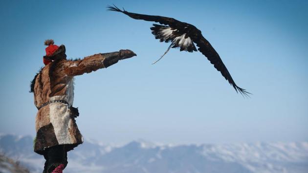A man releases an eagle during the Spring Eagle Festival in Ulaanbaatar, the capital of Mongolia. Members of Mongolia's Kazakh ethnic group celebrated their 6,000-year history of eagle hunting with an annual Eagle Festival. (Byambasuren Byamba-Ochir / AFP) A man releases an eagle during the Spring Eagle Festival in Ulaanbaatar, the capital of Mongolia. Members of Mongolia's Kazakh ethnic group celebrated their 6,000-year history of eagle hunting with an annual Eagle Festival. (Byambasuren Byamba-Ochir / AFP)
