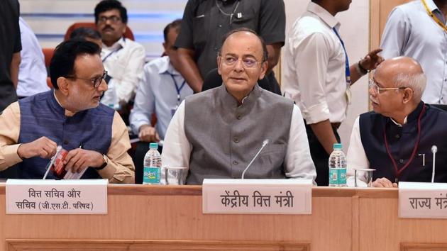 Union finance minister Arun Jaitley with MoS for finance Shiv Pratap Shukla and revenue secretary Hasmukh Adhia at the 26th meeting of the Goods and Services Tax (GST) Council, in New Delhi on Saturday. (PTI Photo) Union finance minister Arun Jaitley with MoS for finance Shiv Pratap Shukla and revenue secretary Hasmukh Adhia at the 26th meeting of the Goods and Services Tax (GST) Council, in New Delhi on Saturday. (PTI Photo)