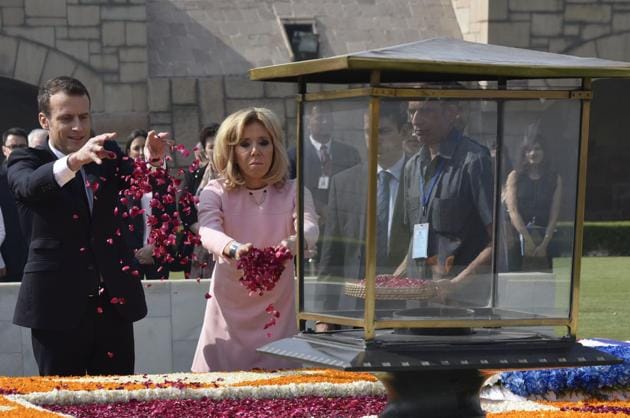 Macron and wife Brigitte offer tributes at Rajghat memorial for Mahatma Gandhi on March 10, 2018. An agreement on the Jaitapur nuclear power plant, being built with French assistance, is expected to be signed during the visit. Stepping up cooperation in the Indian Ocean region will be among top issues that will be discussed by Macron and Prime Minister Modi during today’s delegation-level talks. (Vipin Kumar / HT Photo) 