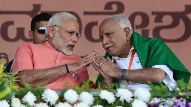 Prime Minister Narendra Modi with Karnataka BJP president and chief ministerial candidate BS Yeddyurappa during the party's 'Farmers Convention' at Davanagere.(PTI File Photo)