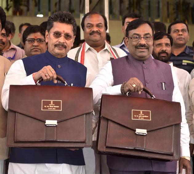 (R to L) Minister of State for Home (Rural), Finance and Planning Deepak Kesarkar along with Cabinet Minister of Finance & Planning and Forests Sudhir Mungantiwar stands for a photo opportunity before presenting the State Budget in House, during budget session at Vidhan Bhavan. (Anshuman Poyrekar/HT Photo) (R to L) Minister of State for Home (Rural), Finance and Planning Deepak Kesarkar along with Cabinet Minister of Finance & Planning and Forests Sudhir Mungantiwar stands for a photo opportunity before presenting the State Budget in House, during budget session at Vidhan Bhavan. (Anshuman Poyrekar/HT Photo)