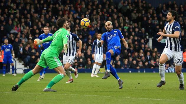 Leicester City's Algerian midfielder Riyad Mahrez (2R) scores his team's second goal past West Bromwich Albion's English goalkeeper Ben Foster during their Premier League match at The Hawthorns stadium in West Bromwich, central England, on Saturday. (AFP) Leicester City's Algerian midfielder Riyad Mahrez (2R) scores his team's second goal past West Bromwich Albion's English goalkeeper Ben Foster during their Premier League match at The Hawthorns stadium in West Bromwich, central England, on Saturday. (AFP)