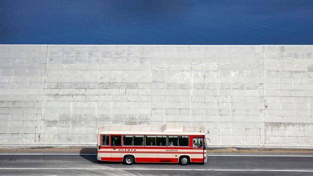 In 2011, an earthquake caused a tsunami which swarmed the old breakwaters and slammed into Japan’s shores, reaching as high as 30 metres, killing nearly 18,000 people and triggered a nuclear meltdown in Fukushima. Seven years on, thousands along Japan’s northeast coast have rebuilt lives alongside huge sea walls that experts say will protect them if another giant tsunami was to strike. (Kim Kyung-Hoon / REUTERS) In 2011, an earthquake caused a tsunami which swarmed the old breakwaters and slammed into Japan’s shores, reaching as high as 30 metres, killing nearly 18,000 people and triggered a nuclear meltdown in Fukushima. Seven years on, thousands along Japan’s northeast coast have rebuilt lives alongside huge sea walls that experts say will protect them if another giant tsunami was to strike. (Kim Kyung-Hoon / REUTERS)