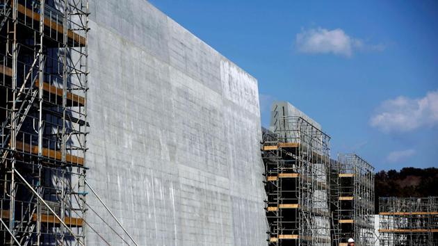 Many municipalities say the giant walls had to be in place before permission could be granted for reconstruction elsewhere. “I can’t say things like ‘the wall should be lower’ or ‘we don’t need it,’” said Katsuhiro Hatakeyama, who has rebuilt his bed and breakfast in the same location as before. “It’s thanks to the wall that I could rebuild, and now have a job.” (Kim Kyung-Hoon / REUTERS) Many municipalities say the giant walls had to be in place before permission could be granted for reconstruction elsewhere. “I can’t say things like ‘the wall should be lower’ or ‘we don’t need it,’” said Katsuhiro Hatakeyama, who has rebuilt his bed and breakfast in the same location as before. “It’s thanks to the wall that I could rebuild, and now have a job.” (Kim Kyung-Hoon / REUTERS)