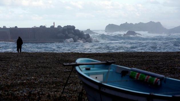 A fisherman watches waves hitting a seawall in Tanohata village. Many find the wall hard to adjust to. “Everyone here has lived with the sea, through generations,” said Sotaro Usui, head of a tuna supply company. “The wall keeps us apart - and that’s unbearable.” (Kim Kyung-Hoon / REUTERS) A fisherman watches waves hitting a seawall in Tanohata village. Many find the wall hard to adjust to. “Everyone here has lived with the sea, through generations,” said Sotaro Usui, head of a tuna supply company. “The wall keeps us apart - and that’s unbearable.” (Kim Kyung-Hoon / REUTERS)