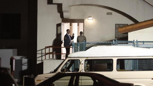 Law enforcement personnel are seen at a building entrance after an active shooter-turned-hostage situation at the Veterans Home of California on March 9, 2018 in Yountville, California.(AFP) Law enforcement personnel are seen at a building entrance after an active shooter-turned-hostage situation at the Veterans Home of California on March 9, 2018 in Yountville, California.(AFP)