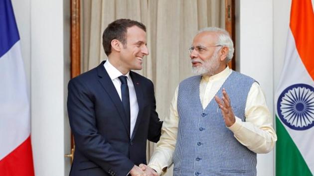 French president Emmanuel Macron shakes hands with Prime Minister Narendra Modi during a photo opportunity ahead of their meeting at Hyderabad House in New Delhi, on March 10, 2018.(Reuters)