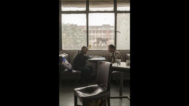 Men sit and talk at the Indian Coffee House, New Delhi, 2010. The Coffee House dates back to 1957, first in central Connaught Place, then Janpath and now at the top of a rather shabby shopping centre. Still run by the Indian Coffee Workers Cooperative Society, it was a regular haunt for politicos in Delhi. (© Stuart Freedman / Tasveer)