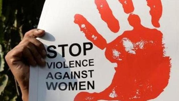 A social activist holds a placard during a protest against a rape, in New Delhi on February 21, 2017. (AFP FILE)