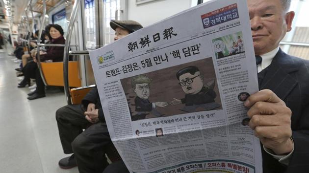 A passenger reads a newspaper with headline of a planned summit meeting between North Korean leader Kim Jong Un and US President Donald Trump at subway train in Seoul, South Korea, on March 10, 2018. (AP Photo) A passenger reads a newspaper with headline of a planned summit meeting between North Korean leader Kim Jong Un and US President Donald Trump at subway train in Seoul, South Korea, on March 10, 2018. (AP Photo)