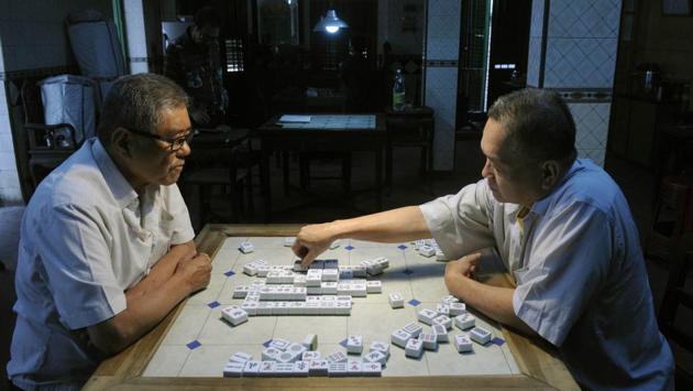 (L-R): Chang TC, a dentist and chef Chang Chen Fa play Mahjong at an Indian-Chinese club at Poddar Court, Tiretta Bazaar in Kolkata. The Chinese who came to Kolkata were mainly from coastal China. Many landed in between the two world wars too. All had different skills and traditions, which they innovated, in order to survive. (Samir Jana / HT PHOTO)