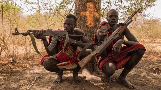 Decades of civil war displaced millions of Dinka people with some relocated to America where they came to be known as the ‘Lost Boys of Sudan.’ When the Dinka met the world after the peace treaty of 2005, their spears had been exchanged for Kalashnikovs, and their beadwork bodices often for western clothes.  (Stefanie Glinski / AFP) 
