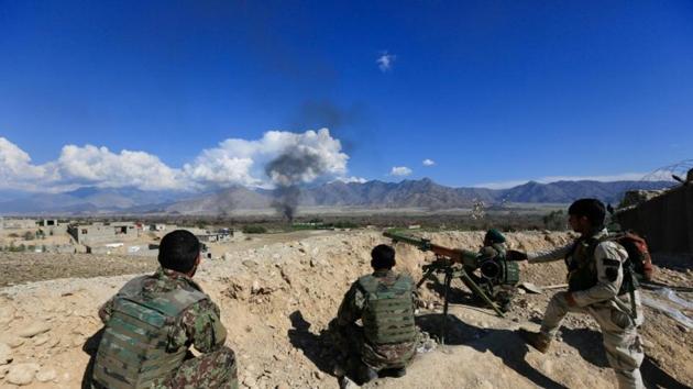 Afghan security forces take position during a gun battle between Taliban and Afghan security forces in Laghman province, Afghanistan on March 1, 2017.(Reuters)