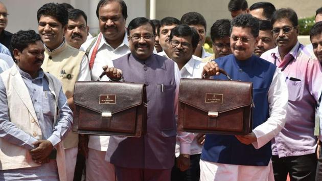 State finance minister Sudhir Mungantiwar and minister for state for finance Deepak Kesarkar arrive at Vidhan Bhavan, Mumbai, on Friday afternoon to present the state budget. (HT File.) State finance minister Sudhir Mungantiwar and minister for state for finance Deepak Kesarkar arrive at Vidhan Bhavan, Mumbai, on Friday afternoon to present the state budget. (HT File.)