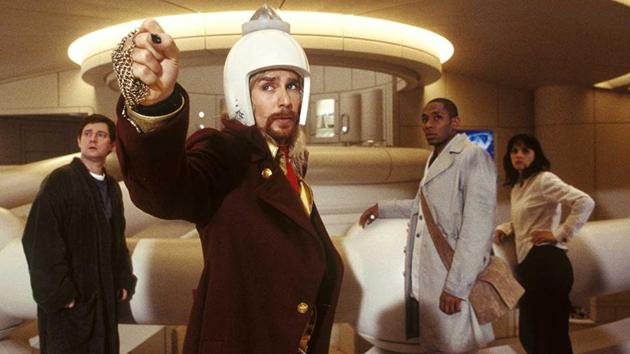 Sam Rockwell (centre), Yasiin Bey (on right), Zooey Deschanel (far right), and Martin Freeman (left) in a still from the movie, The Hitchhiker’s Guide to the Galaxy (2005).(IMDb.com)