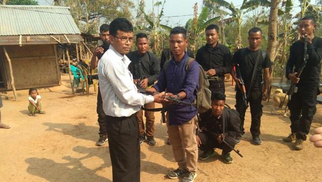 Eight members of rebel outfit Garo National Liberation Army surrender before Rev ST Sangma in East Garo Hills district. (HT Photo) Eight members of rebel outfit Garo National Liberation Army surrender before Rev ST Sangma in East Garo Hills district. (HT Photo)