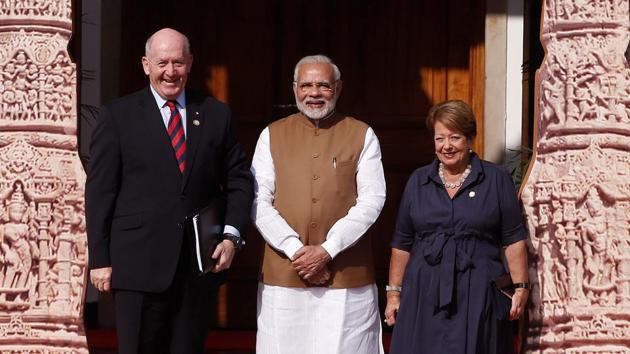 Prime Minister Narendra Modi (C) poses for a picture with Australia's Governor General Peter Cosgrove and his wife Lynne (R) as they arrive to attend the International Solar Alliance Founding Conference in New Delhi.(REUTERS)