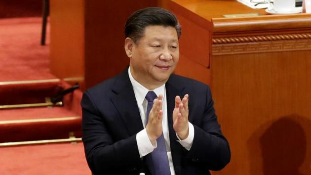Chinese President Xi Jinping applauds after the parliament passed a constitutional amendment lifting presidential term limit, at the third plenary session of the National People's Congress (NPC) at the Great Hall of the People in Beijing.(REUTERS) Chinese President Xi Jinping applauds after the parliament passed a constitutional amendment lifting presidential term limit, at the third plenary session of the National People's Congress (NPC) at the Great Hall of the People in Beijing.(REUTERS)