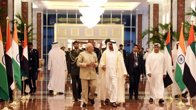 Prime Minister Narendra Modi being welcomed by Crown Prince of Abu Dhabi, Deputy Supreme Commander of UAE Armed Forces, General Sheikh Mohammed Bin Zayed Al Nahyan, on his arrival, at Abu Dhabi, United Arab Emirates.(PTI File Photo)