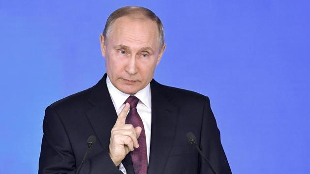Russian President Vladimir Putin gestures as he gives his annual state of the nation address in Manezh in Moscow, Russia. (AP) Russian President Vladimir Putin gestures as he gives his annual state of the nation address in Manezh in Moscow, Russia. (AP)