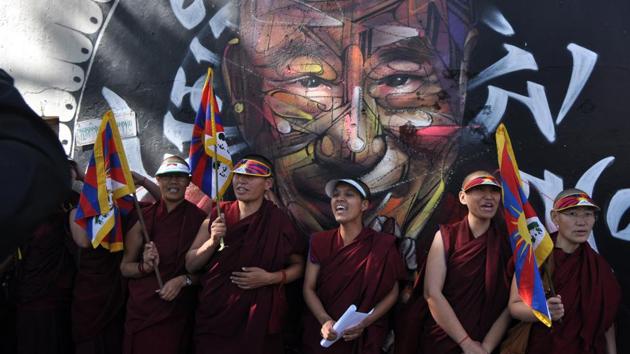 Exiled Tibetan Buddhist nuns in front of a mural of Tibetan spiritual leader, Dalai Lama during a gathering to mark the 59th anniversary of National Tibetan Women’s Uprising day at Mcleodganj near Dharamsala. (Shyam Sharma / HT Photo) Exiled Tibetan Buddhist nuns in front of a mural of Tibetan spiritual leader, Dalai Lama during a gathering to mark the 59th anniversary of National Tibetan Women’s Uprising day at Mcleodganj near Dharamsala. (Shyam Sharma / HT Photo)