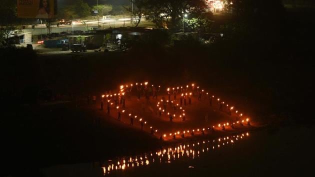 Students of COEP display Mashal dance during the 90th Regatta at Boat Club in Pune. (Pratham Gokhale/HT Photo)