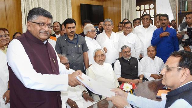 Union minister Ravi Shankar Prasad filing his nomination paper for Rajya Sabha elections in the presence of Bihar chief minister Nitish Kumar and deputy CM Sushil Kumar Modi at Bihar Assembly in Patna on Monday. (PTI) Union minister Ravi Shankar Prasad filing his nomination paper for Rajya Sabha elections in the presence of Bihar chief minister Nitish Kumar and deputy CM Sushil Kumar Modi at Bihar Assembly in Patna on Monday. (PTI)