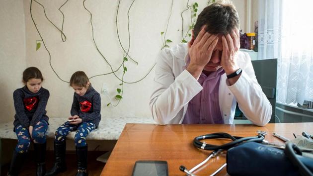 Two young patients wait after being seen by Doctor Dmitriy Rozumiy (R) in a small clinic in the village of Ivankovichy, Ukraine. The family physician, like his counterparts elsewhere in the country, struggles to bridge the gap between what his patients in rural Ukraine need and what the country’s cash-strapped healthcare system can provide. (Gleb Garanich / REUTERS) Two young patients wait after being seen by Doctor Dmitriy Rozumiy (R) in a small clinic in the village of Ivankovichy, Ukraine. The family physician, like his counterparts elsewhere in the country, struggles to bridge the gap between what his patients in rural Ukraine need and what the country’s cash-strapped healthcare system can provide. (Gleb Garanich / REUTERS)