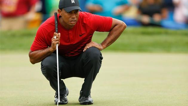 Tiger Woods looks over a putt on the 18th hole during the final round of the Valspar Championship at Innisbrook Resort Copperhead Course on Sunday.(AFP)
