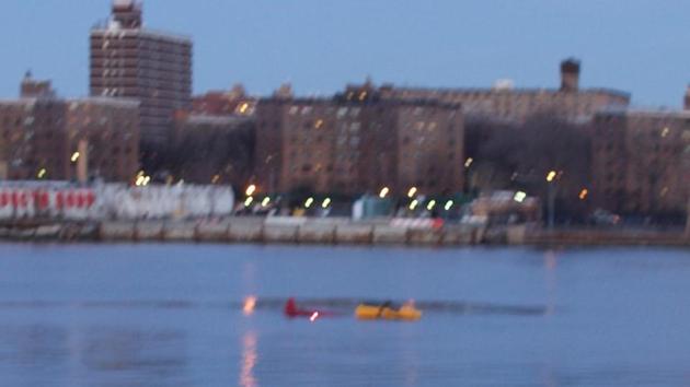 A helicopter is seen crashed in New York City’s East River on Sunday.(Reuters Photo)