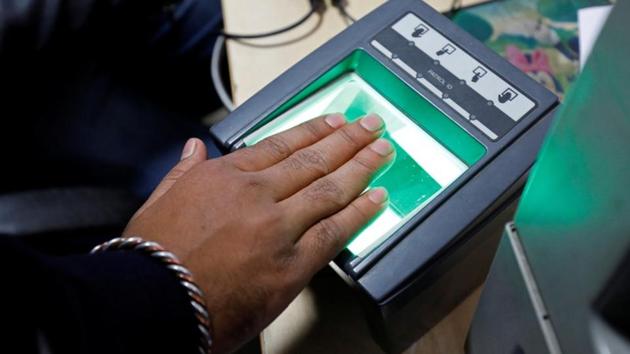 A woman goes through the process of finger scanning for the Unique Identification (UID) database system, also known as Aadhaar, at a registration centre in New Delhi. (REUTERS FILE PHOTO) A woman goes through the process of finger scanning for the Unique Identification (UID) database system, also known as Aadhaar, at a registration centre in New Delhi. (REUTERS FILE PHOTO)