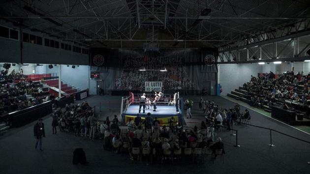 A crowd watches Darkmundo and Alex Legrand fighting during a one-on-one match. Muscles bulging, hair flying, the wrestlers put on quite a show — with losers tossed out of the ring in the grand finale. But the aim of the catch wrestling gala in the communist-run Parisian suburb wasn’t to make a profit or showcase celebrities. (Kamil Zihnioglu / AP) A crowd watches Darkmundo and Alex Legrand fighting during a one-on-one match. Muscles bulging, hair flying, the wrestlers put on quite a show — with losers tossed out of the ring in the grand finale. But the aim of the catch wrestling gala in the communist-run Parisian suburb wasn’t to make a profit or showcase celebrities. (Kamil Zihnioglu / AP)
