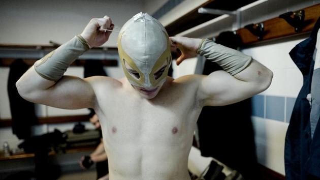 Wrestler Ace Angel ties his mask before heading out. The event was celebrating the anniversary of a charity group called the Association for Employment, Information and Solidarity with the Unemployed and At-Risk Workers. (Kamil Zihnioglu / AP) Wrestler Ace Angel ties his mask before heading out. The event was celebrating the anniversary of a charity group called the Association for Employment, Information and Solidarity with the Unemployed and At-Risk Workers. (Kamil Zihnioglu / AP)