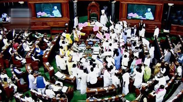 Opposition members protest during the ongoing budget session of Parliament at the Lok Sabha in New Delhi on Tuesday. (PTI Photo) Opposition members protest during the ongoing budget session of Parliament at the Lok Sabha in New Delhi on Tuesday. (PTI Photo)