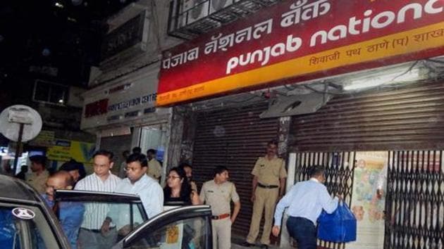 Enforcement Directorate officials outside a PNB branch after they seized cash, jewellery and bonds worth several crores during a raid in Thane. (PTI File Photo) Enforcement Directorate officials outside a PNB branch after they seized cash, jewellery and bonds worth several crores during a raid in Thane. (PTI File Photo)