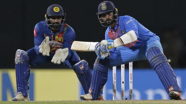 India's Dinesh Karthik plays a shot as Sri Lanka's Kusal Perera watches during their Twenty20 encounter. (AP) India's Dinesh Karthik plays a shot as Sri Lanka's Kusal Perera watches during their Twenty20 encounter. (AP)
