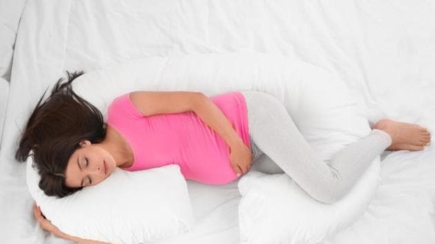 how to get comfortable in bed while pregnant