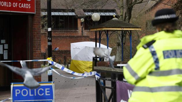 Police officers stand on duty near bench covered in a protective tent at The Maltings shopping centre in Salisbury, southern England, on March 14, 2018, where a man and woman were found critically ill on March 4, after being apparently poisoned with what was later identified as a nerve agent sparking a major incident. British Prime Minister Theresa May said Britain will expel 23 Russian diplomats in retaliation for the nerve agent attack on a former Russian double agent. (AFP Photo) Police officers stand on duty near bench covered in a protective tent at The Maltings shopping centre in Salisbury, southern England, on March 14, 2018, where a man and woman were found critically ill on March 4, after being apparently poisoned with what was later identified as a nerve agent sparking a major incident. British Prime Minister Theresa May said Britain will expel 23 Russian diplomats in retaliation for the nerve agent attack on a former Russian double agent. (AFP Photo)