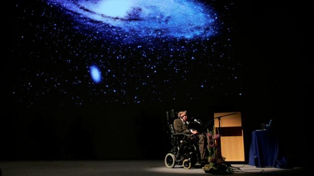 Hawking delivers a lecture on “The Origin of the Universe” on May 20, 2007 in Brussels. Faced with an ever-increasing risk of being wiped out by a disaster such as sudden global warming, nuclear war, a genetically engineered virus or other dangers, it was in space, where he believed humankind’s destiny lay. More recently he said artificial intelligence could contribute to the eradication of disease and poverty, while warning of its potential dangers. (Francois Lenoir / REUTERS File)