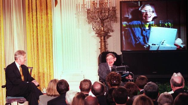 US President Bill Clinton (L) and Stephen Hawking (R) watch a scene from “Star Trek the Next Generation” at the White House on March 6, 1998. Fascinated by the nature of the universe, how it was formed and how it might end, much of Hawking’s work centered on the quest for a “unified theory” bringing together relativity -- the nature of space and time -- and quantum theory -- how the smallest particles in the Universe behave. (Tim Sloan / AFP File)