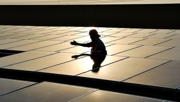 With pass through of any hike in duties, solar power developers will be allowed to increase the tariffs based on which they have bagged the projects, so as to recover the extra cost. (AFP File Photo) With pass through of any hike in duties, solar power developers will be allowed to increase the tariffs based on which they have bagged the projects, so as to recover the extra cost. (AFP File Photo)