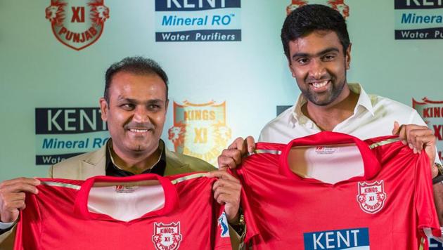 Kings XI mentor Virender Sehwag and captain R Ashwin unveil their team jersey for the Indian Premier League 2018 in New Delhi on Tuesday.(PTI)