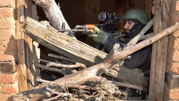 An Army soldier takes position during a gun battle in which three militants were killed, at Kokarnag in Anantnag district of South Kashmir on March 13 2018.(PTI File Photo)