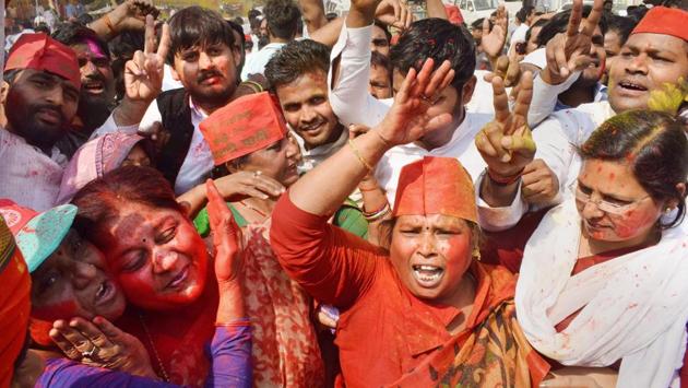 Samajwadi Party supporters celebrate their lead in Phulpur and Gorakhpur Lok Sabha by-poll election, in Allahabad on Wednesday.(PTI)